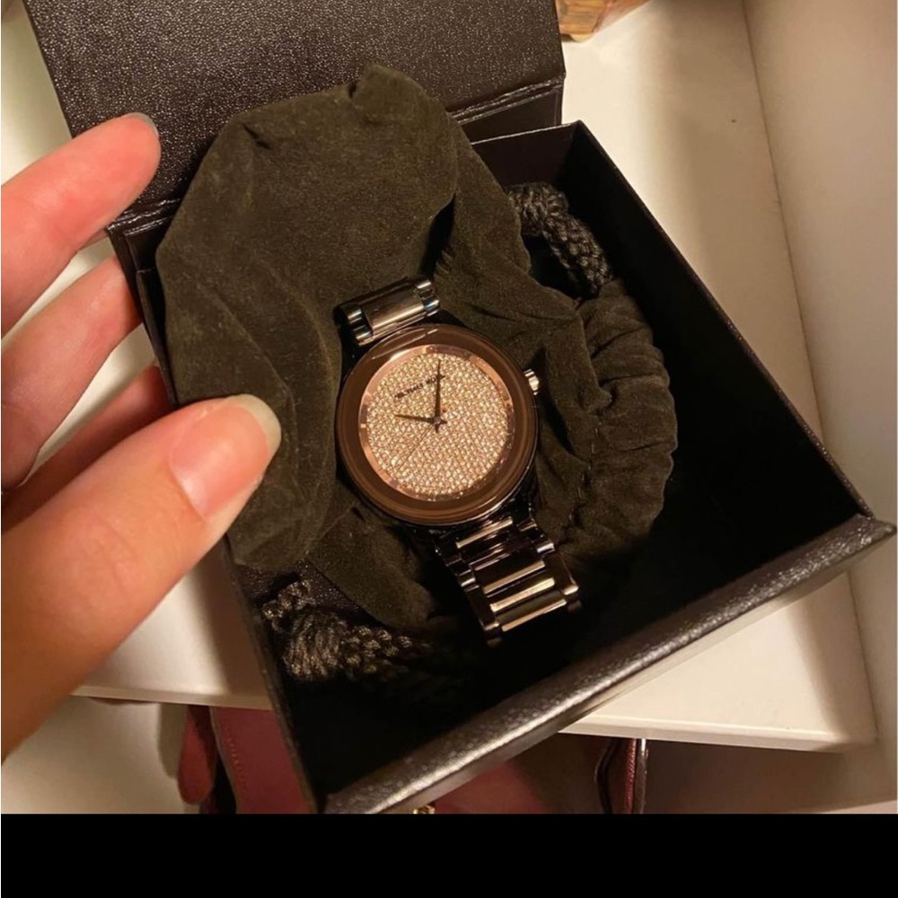 Chocolate and rose gold Michael Kors watch.